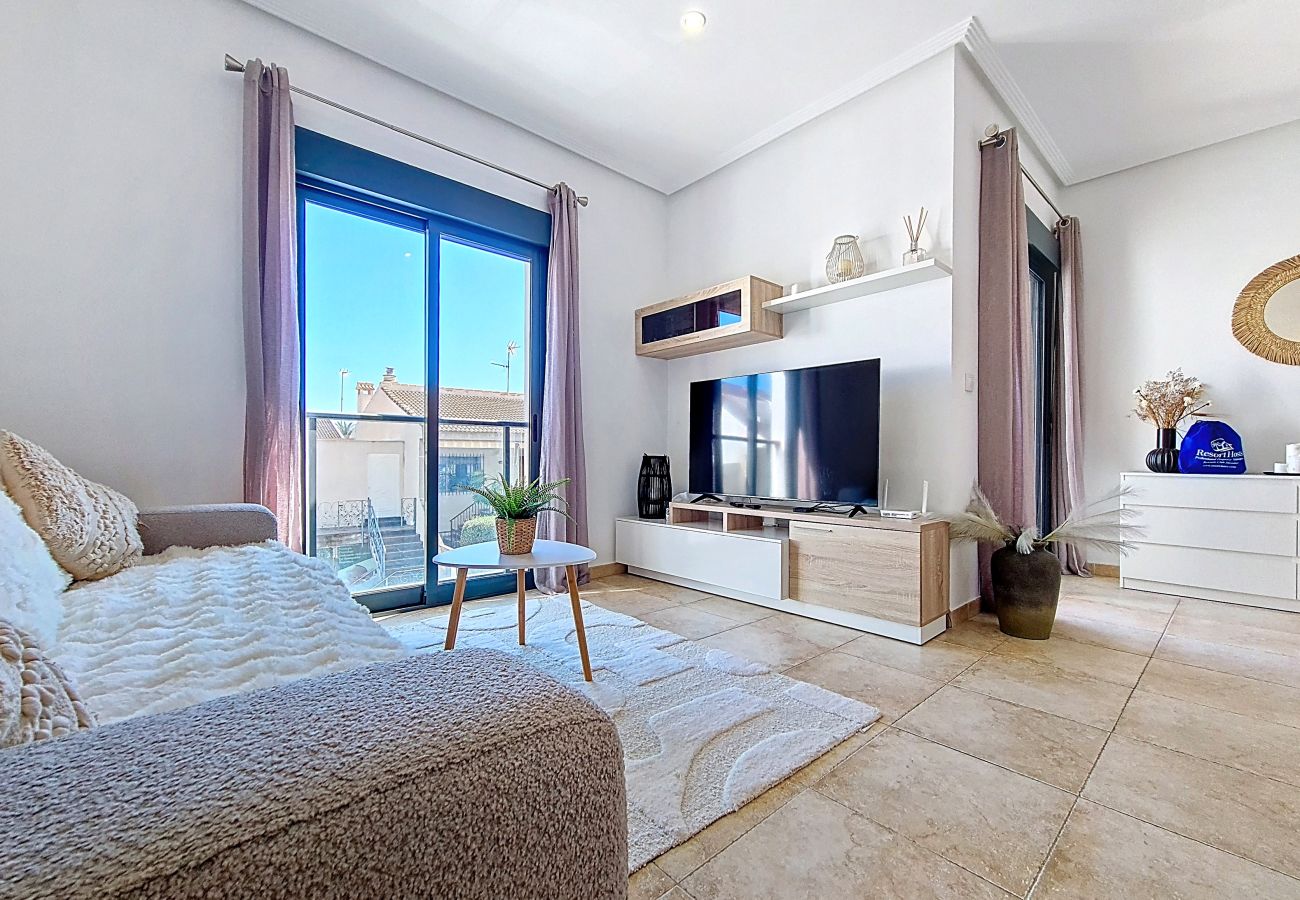 Bright living area of 2-bedroom apartment in San Pedro del Pinatar with patio access and modern furnishings